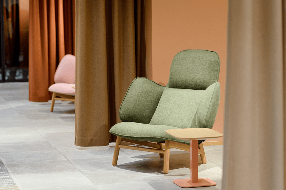 Green armchair in a showroom
